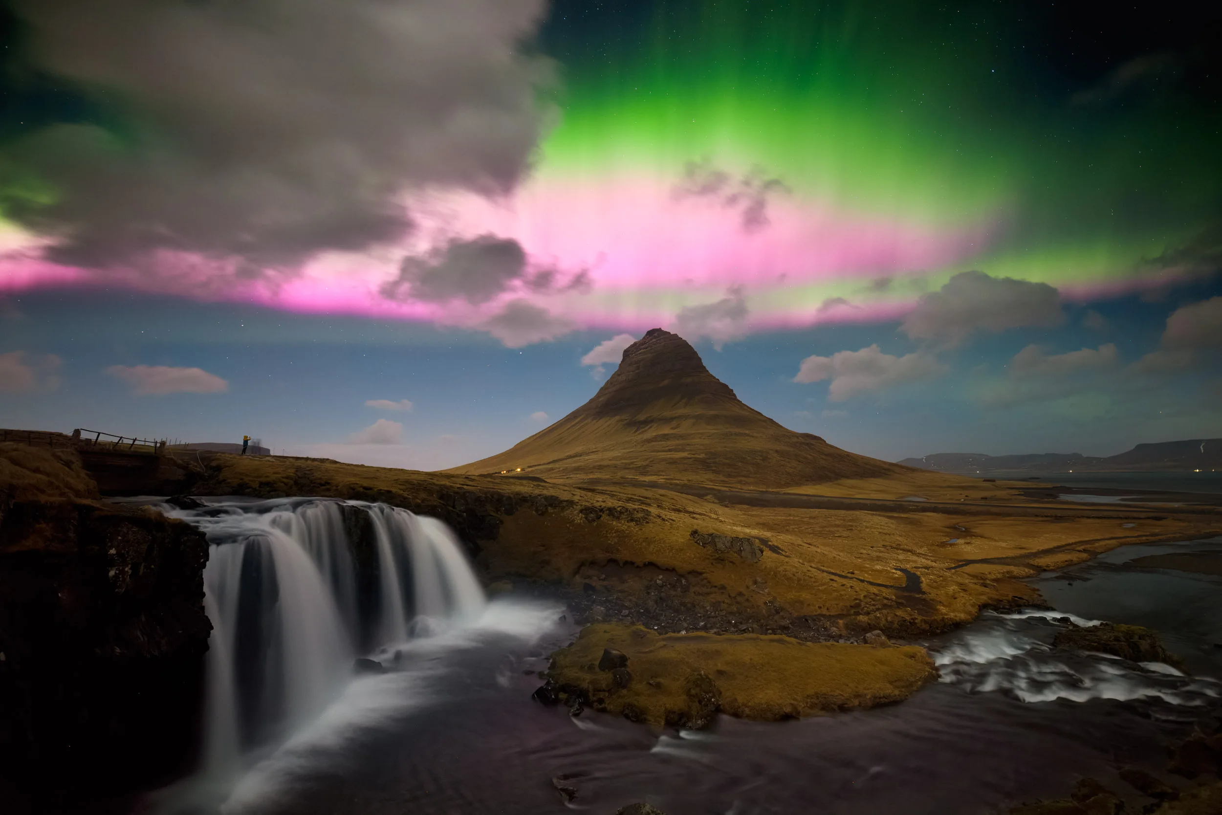 Astonishing multicolor aurora over Kirkjufell mountain in Iceland